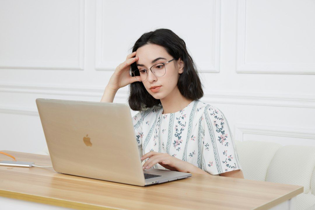 Turkish woman presenter reviewing a script on a laptop