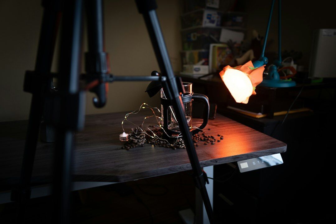 Professional video camera on tripod with studio softbox lighting